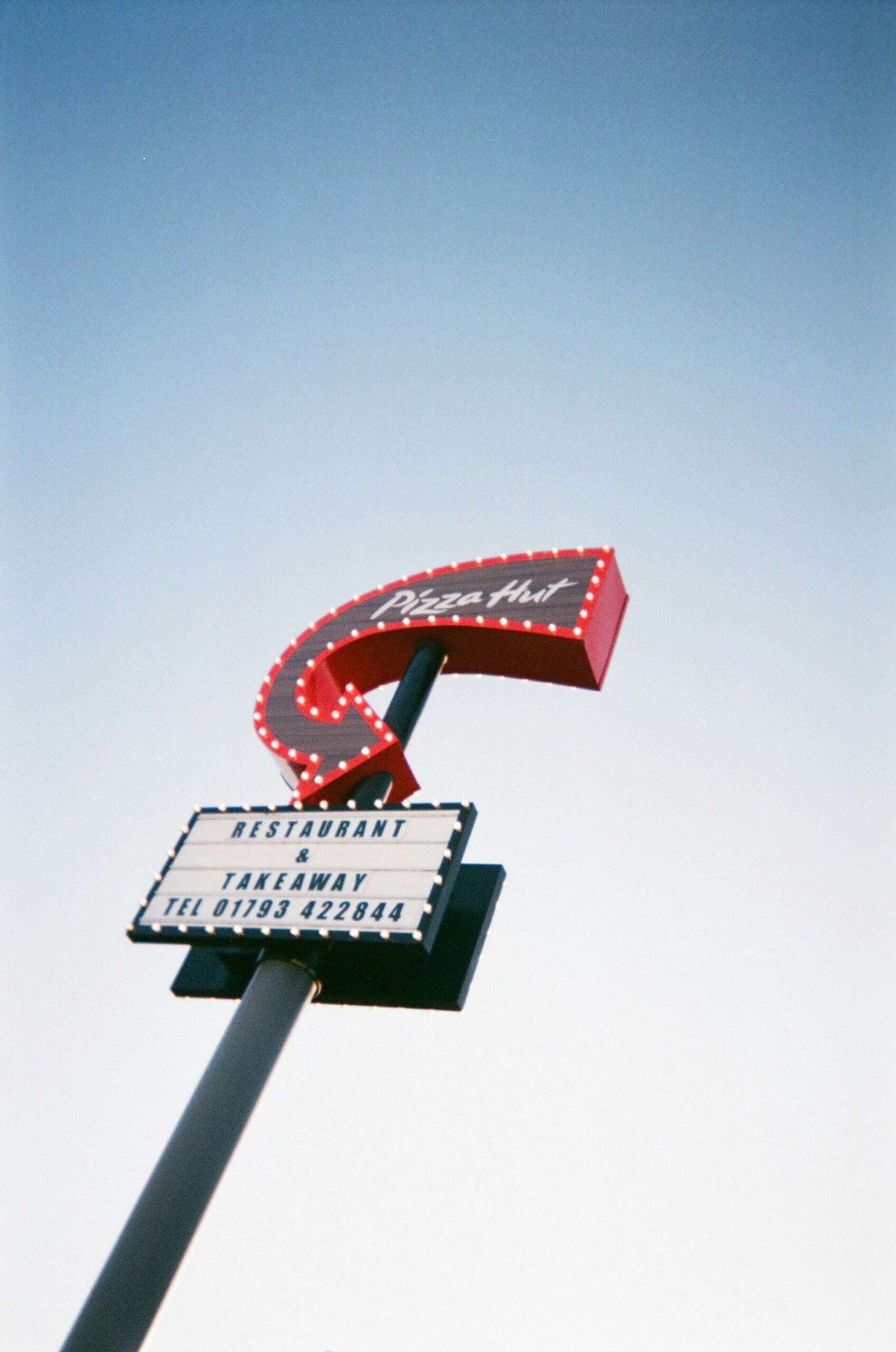 a sign that is on top of a pole