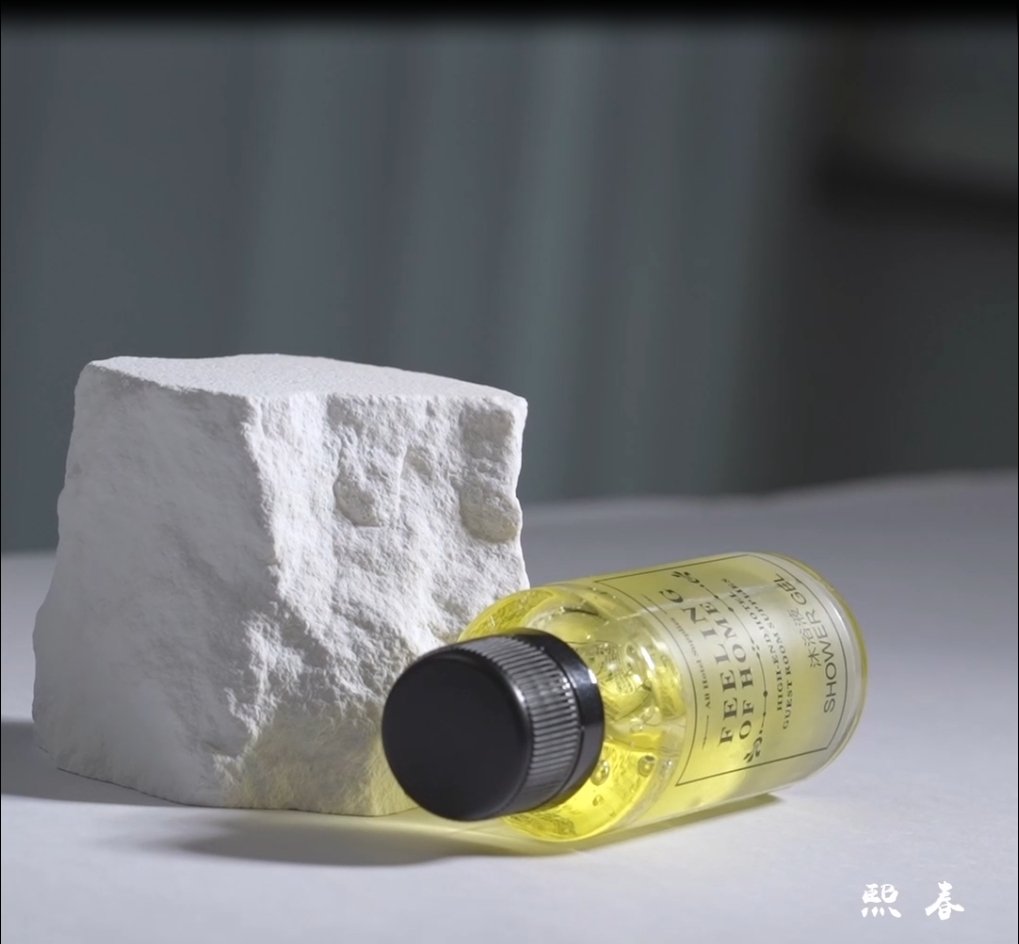 a shower gel behind the rock