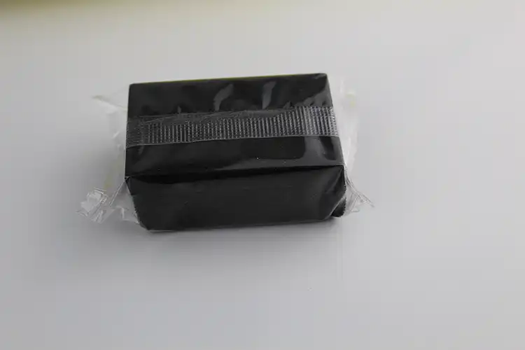 A black shoe mitt with OPP arround